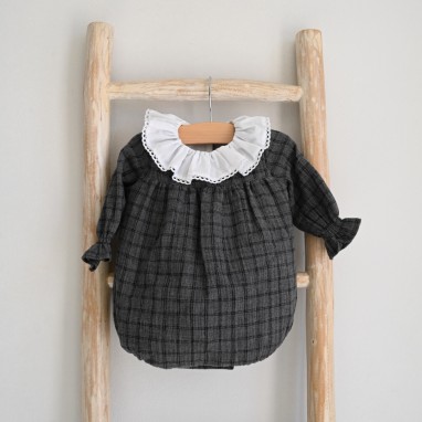 Long sleeved dark grey romper with frilly white collar and lace trim