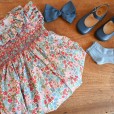Hand smocked and embroidered floral Romper in Liberty